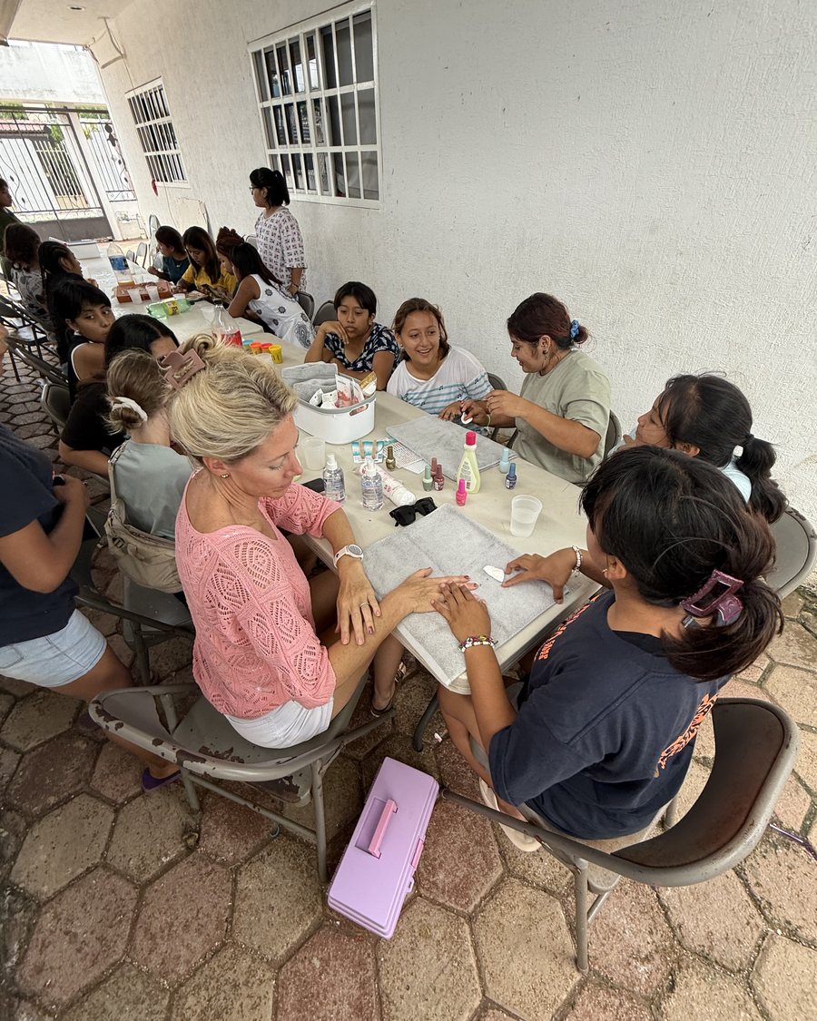 A vocational skills class in session around a shared worktable.
